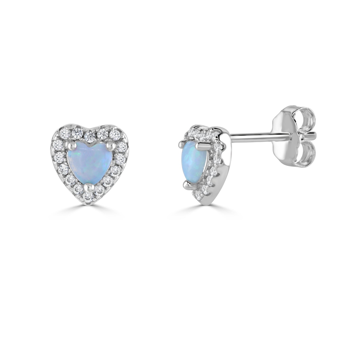 A front and side view of a pair of silver heart shaped stud earrings made from synthetic blue opal surrounded by cubic zirconia gemstones.
