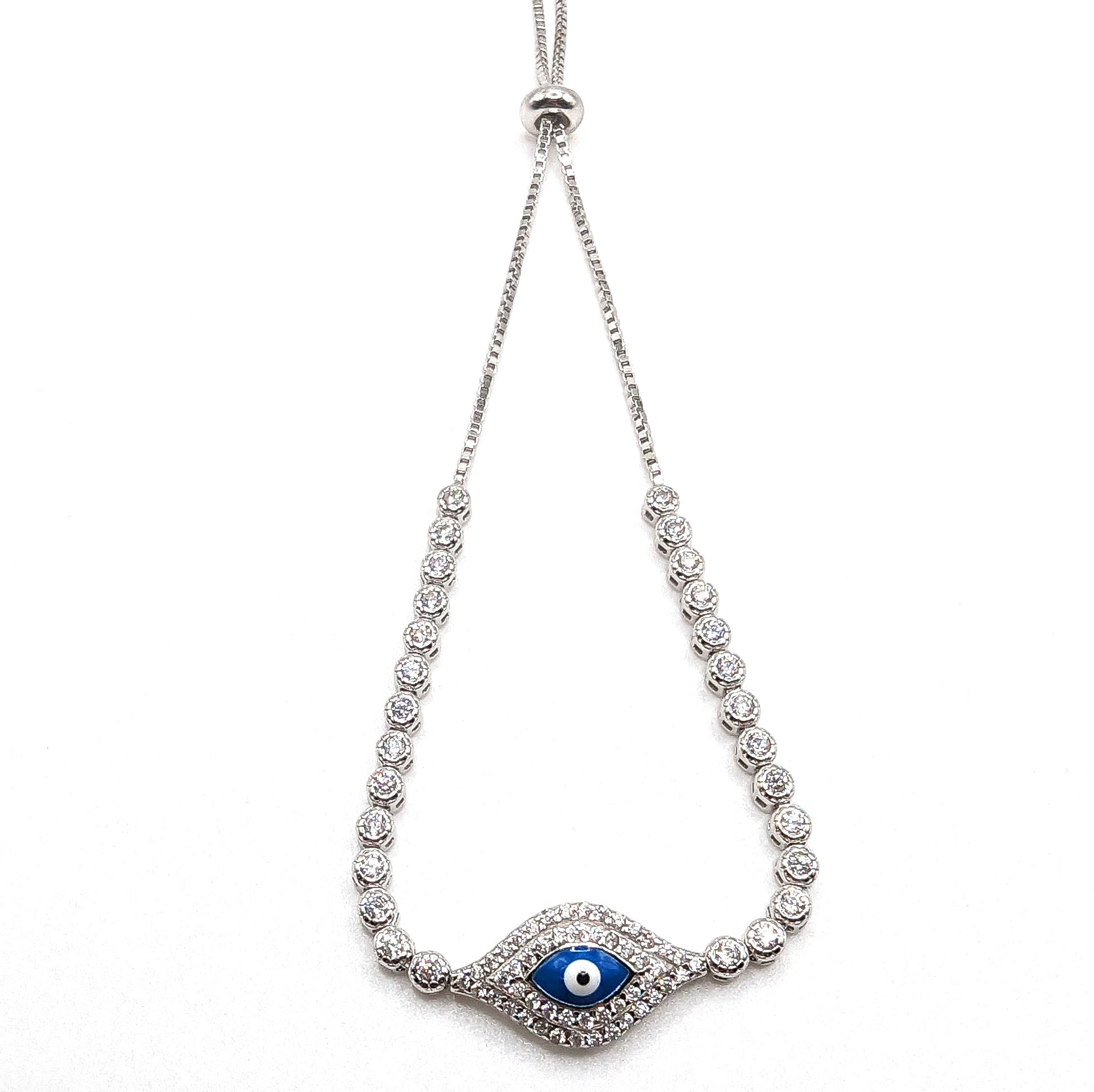 Sterling silver evil eye bracelet featuring cubic zirconia gemstones. The bracelet has a versatile toggle feature for tightening and expanding. 