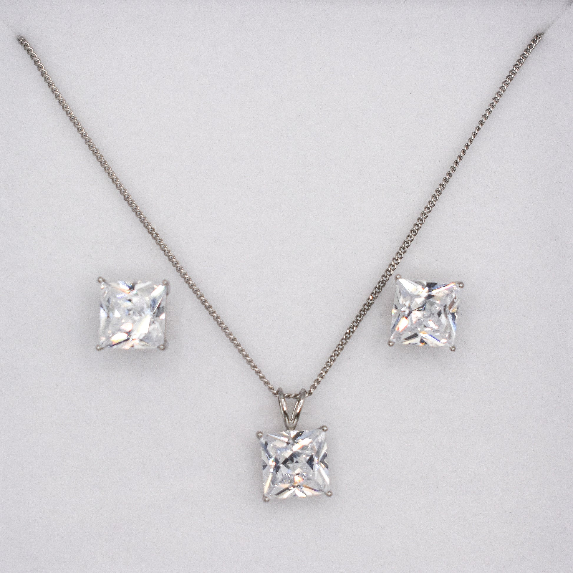 A classic matching set of 925 sterling silver earrings and necklace with square cubic zirconia gemstones. A great gift idea and the perfect finishing touch. 