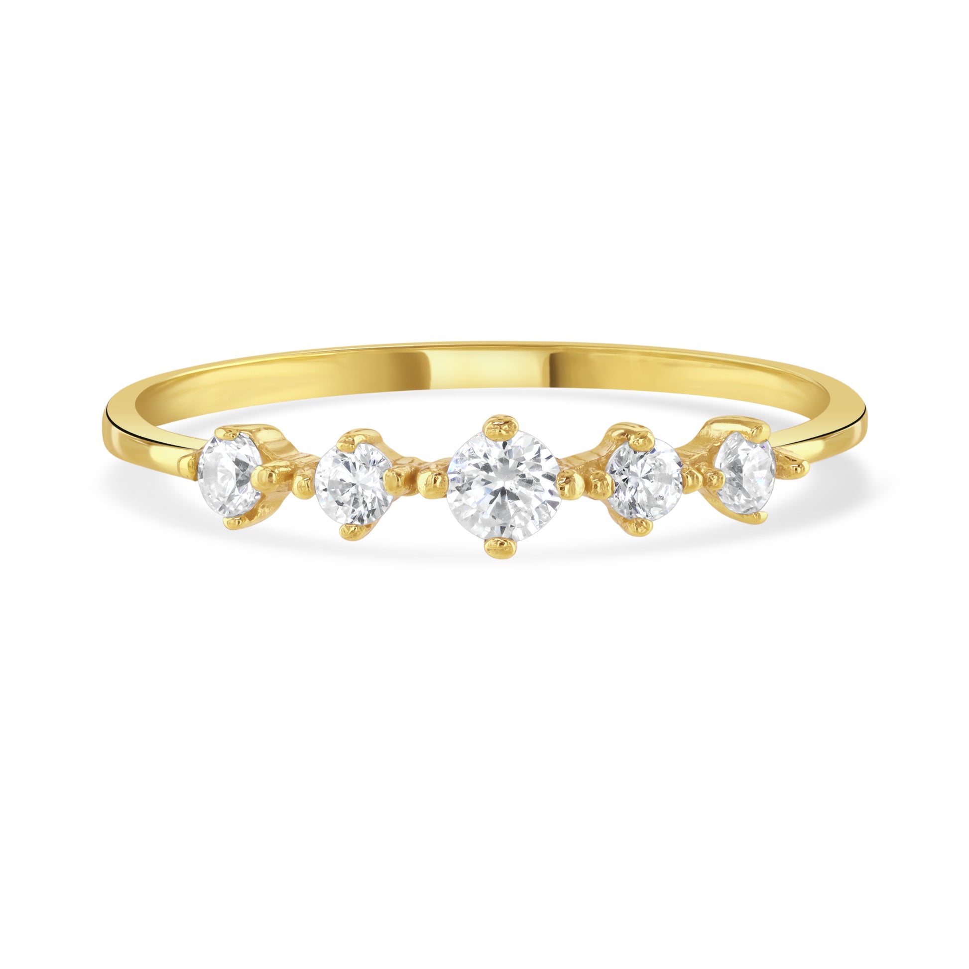Front facing view of the clear sparkling gemstones on the band of a gold ring. 